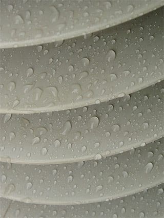 Beads of rainwater on the silicone rubber surface of a high voltage insulator