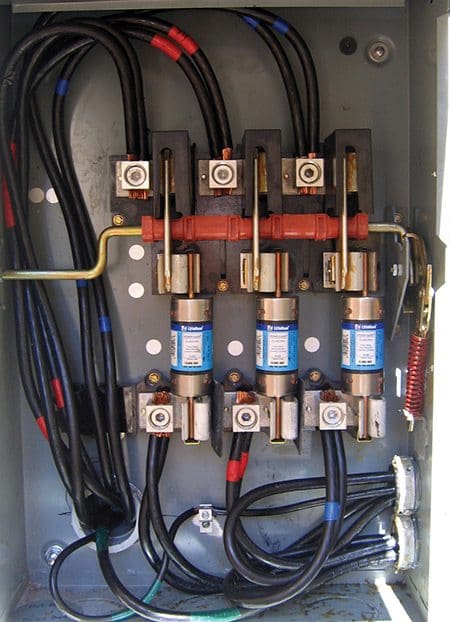 A fused 3-phase safety switch serves as the PV service disconnect at a site employing a supply side connection