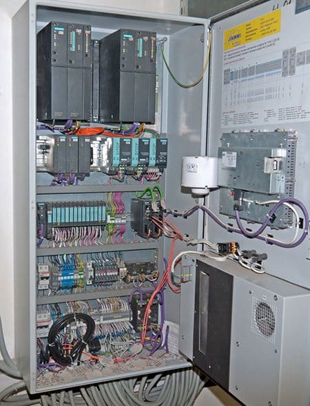 Programmable Logic Controller (PLC) performing local control functions, physically separated, but wired to a nearby Remote Terminal Unit (RTU)