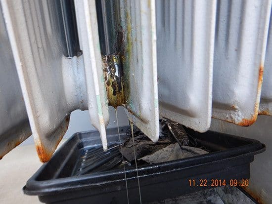 Leaking oil from corroded transformer