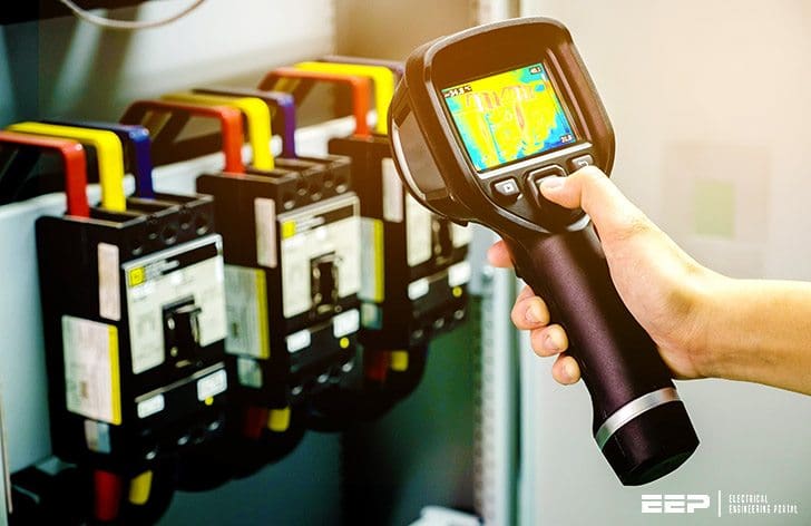 A Basic Guide to Thermography Method Of Inspecting Electrical Equipment (on photo: Technician use thermal imaging camera to check temperature in factory)