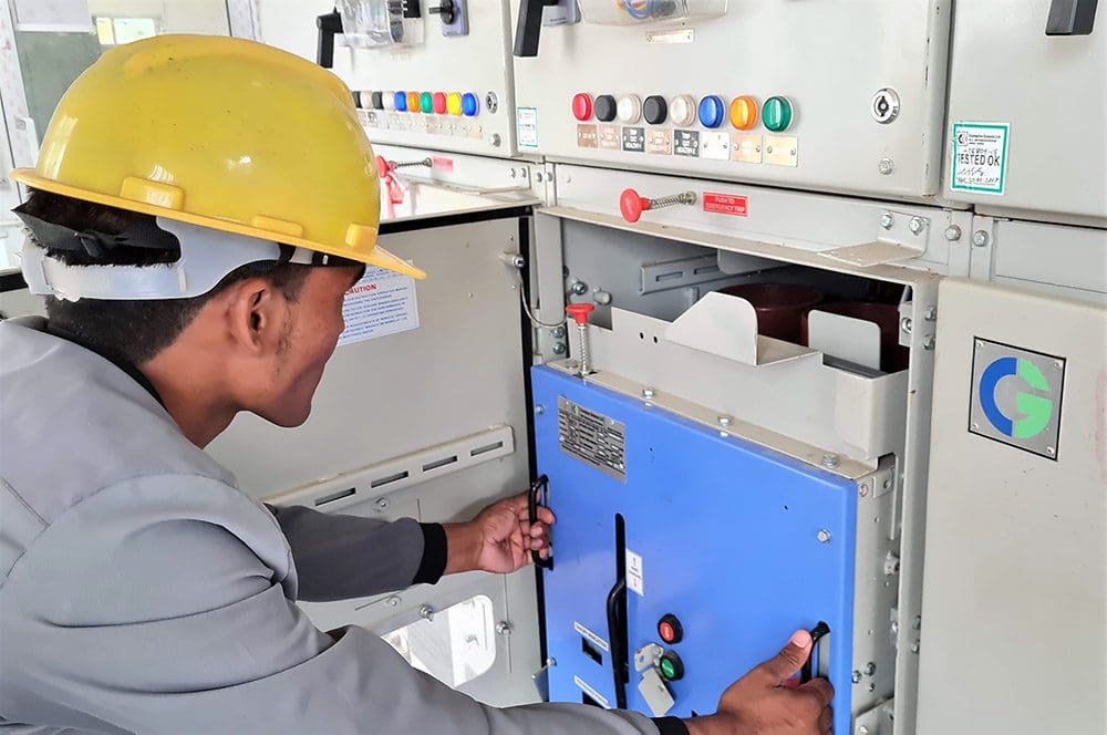 Technician drawing out the VCB trolley for troubleshooting