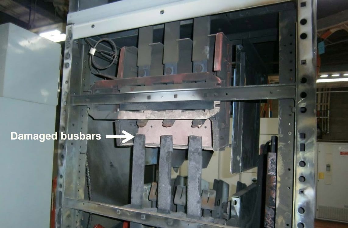 Switchgear cabinet (front and rear panels removed) showing damage from the arc blast