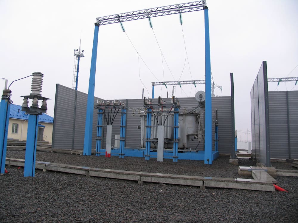 The roof of the control building is painted blue to pair with support structures for transformer incoming/outgoing lines