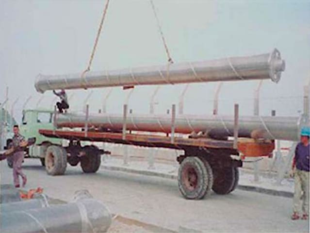 An 18 meter bus section being unloaded at the site