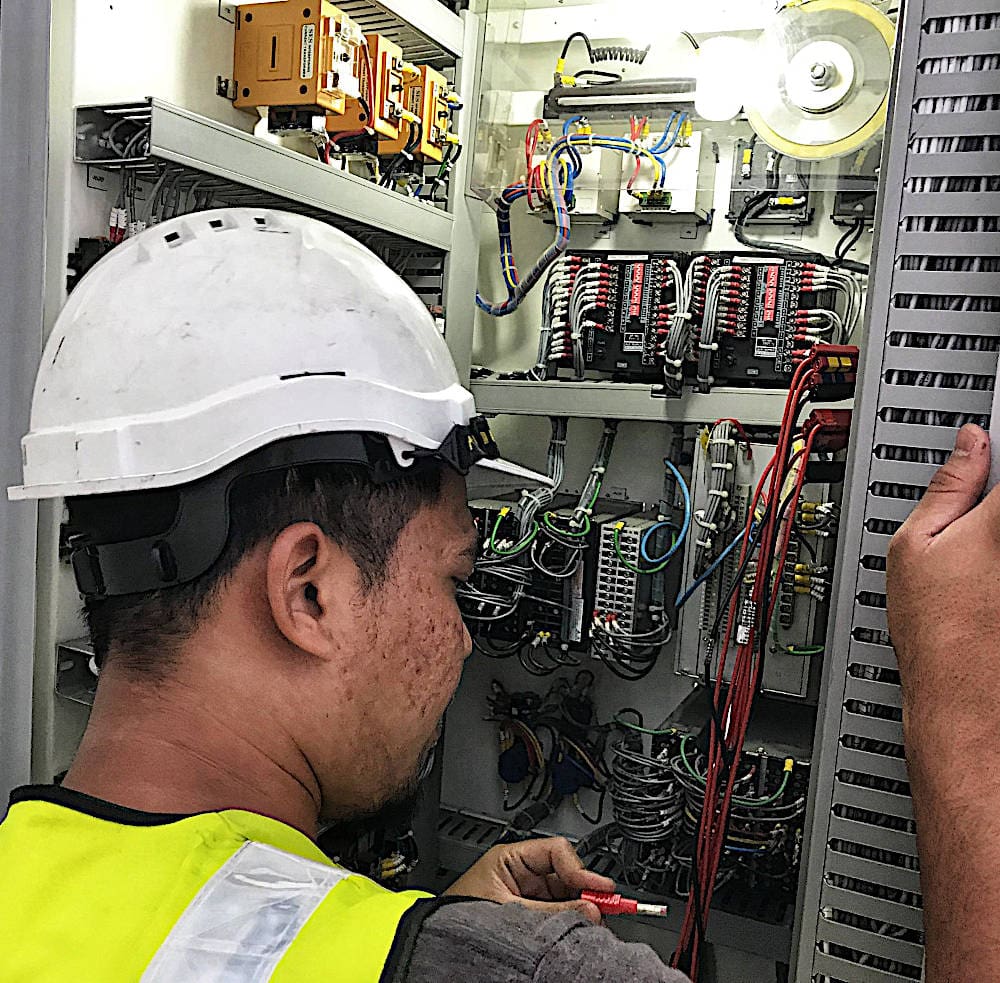 Maintenance engineer testing secondary control and protection equipment