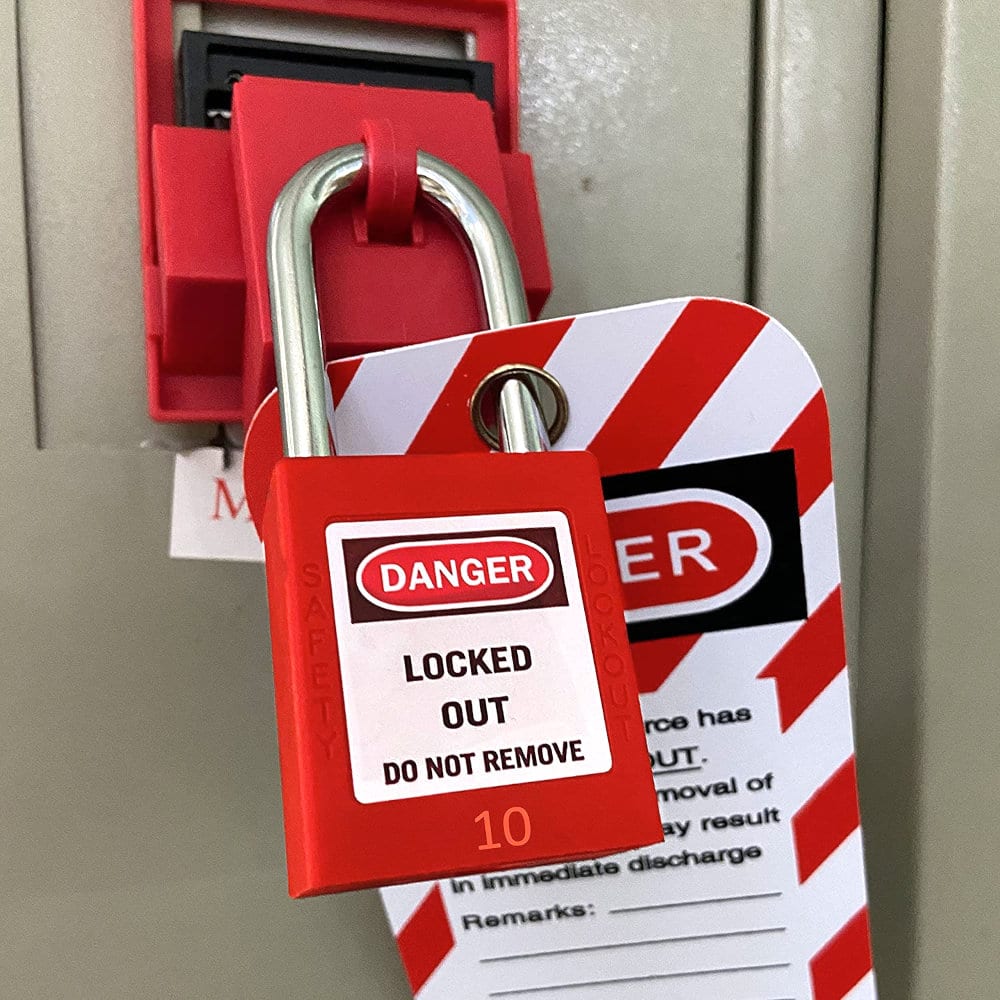 Close-up of a main panel disconnect handle secured with a red LOTO padlock and danger tag