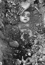 Burial of an unknown child. This unknown child has become the icon of the world's worst industrial disaster' caused by the US multinational chemical company' Union Carbide.