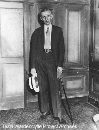 Nikola Tesla standing next to his suite at the Hotel New Yorker - circa 1934