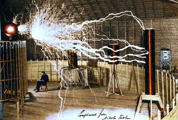 Nikola Tesla in his Colorado Laboratory with magnifying transmitter