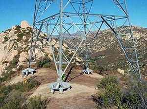 Sunrise caps foundation of transmission tower