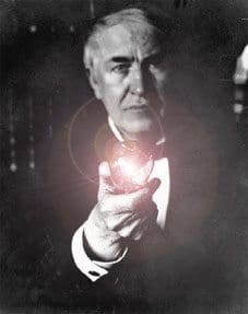 Thomas Edison holding the light bulb